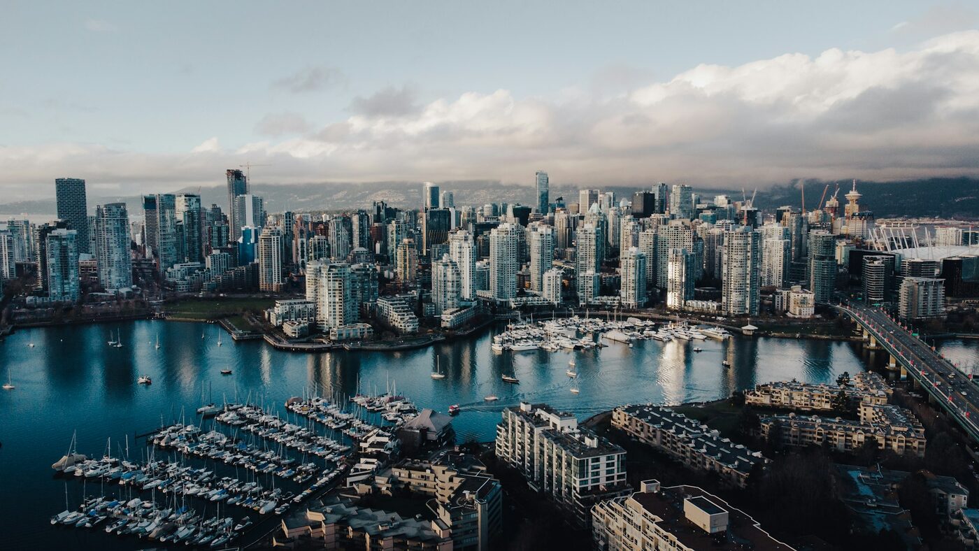 The Vancouver skyline and harbour at dusk, where GoNorth Immigration Consulting is based
